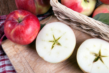Still life of many apples on a napkin in the basket on a napkin