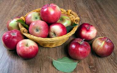 Naklejka na ściany i meble Still life of many apples on a napkin in the basket