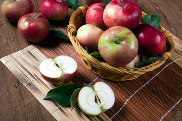 Still life of many apples on a napkin in the basket