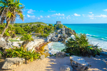 Mayan ruins of Tulum at tropical coast. God of Winds Temple at paradise beach. Mayan ruins of Tulum, Quintana Roo, Mexico. - obrazy, fototapety, plakaty