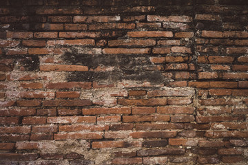 Red old worn brick wall texture background of temple wall. Vintage effect