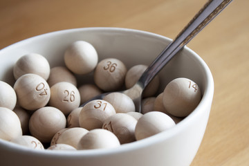 Bowl of Wooden Lottery Balls with Spoon
