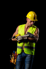 fit shirtless worker with drill and tools