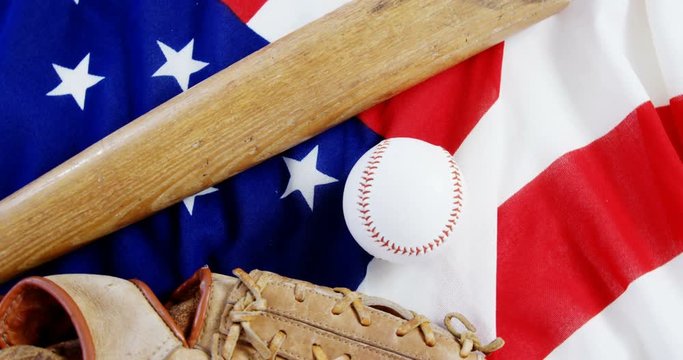 Baseball, baseball bat and  baseball gloves on an American flag