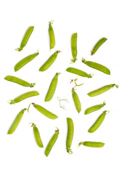 Fresh Sticks of young green peas on a white background..