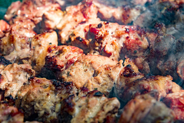 Obraz na płótnie Canvas Sven shashlik closeup mashed slices of meat put on metal skewers roasted on charcoal grill with charcoal on otlichie