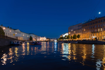 Yachts on Fontanka River at night in St. Petersburg, Russia