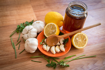 Organic vegetables antioxidant diet with garlic lemon honey and leaves of parsley 