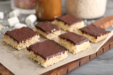Rice crispy treats on wooden board