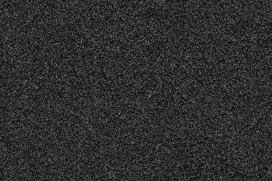 seamless texture of black sponge or foam