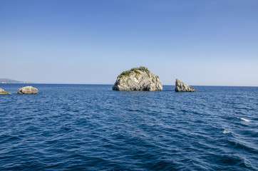 Two rocks in blue sea