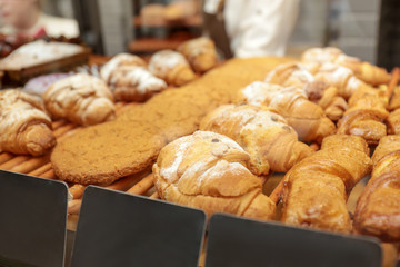 Counter with bakery products in shop, closeup