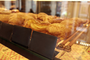 Counter with bakery products in shop, closeup