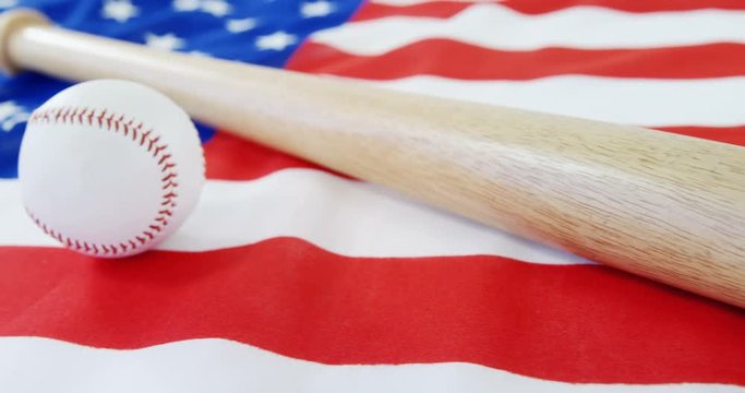 Baseball and baseball bat on an American flag