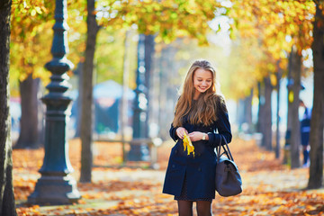 Beautiful young girl in autumn park