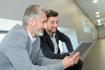 two men and a tablet