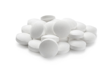 Health care concept. Round pills on white background