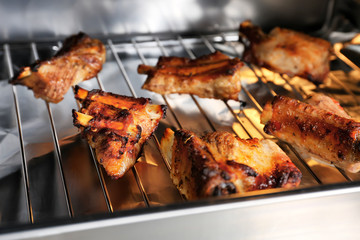 Baking tray with delicious pork ribs, closeup