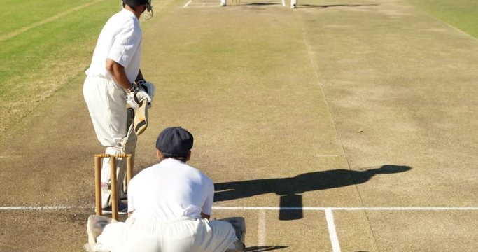 Bowler delivering ball during cricket match