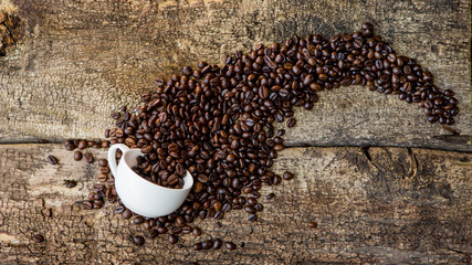 Coffee. Coffee beans. Coffee cup full of coffee beans.