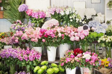 Beautiful peonies and other flowers in shop - obrazy, fototapety, plakaty