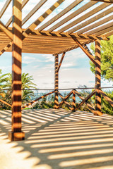 Shadows on wooden outdoor terrace in sunny day