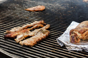 delicious meat ribs beef   grilling on open grill, outdoor kitchen. food festival in city. tasty food roasting, food-court. summer picnic