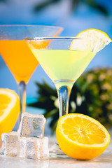 Colorful summer background with drink and palms