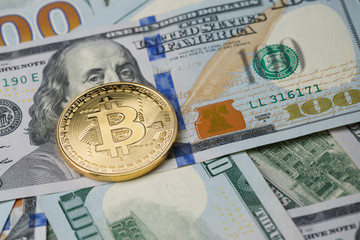 Picture of dollars with gold bitcoin