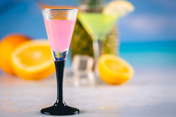 Pink fresh and tasty drinks on a beach