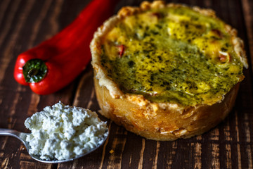 Australian meat pie on the table, a horizontal top view, rustic style. Homemade australian meat pie on the wooden table. Delicious cut meat pie on a plate. American Chicken pot pie