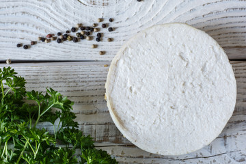Australian meat  pie on the table and avocado, chilli, chips, rustic style. Homemade meat pie on the wooden table. Delicious cut meat pie on a plate. American Chicken pot pie