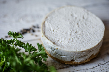 Australian meat  pie on the table and avocado, chilli, chips, rustic style. Homemade meat pie on the wooden table. Delicious cut meat pie on a plate. American Chicken pot pie
