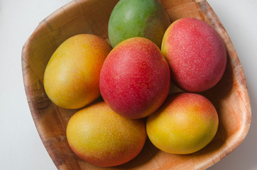 Mangoes in bowl. High angle view.