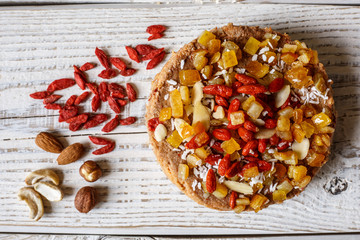 Australian meat  pie on the table and avocado, chilli, chips, rustic style. Homemade meat pie on the wooden table. Delicious cut meat pie on a plate. American Chicken pot pie