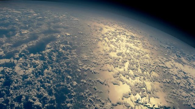 Flight over the Earth's oceans at dawn