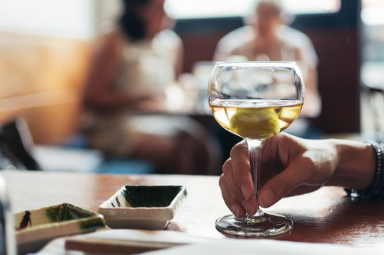 Hand holding Japanese plum wine