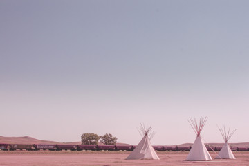group of teepees in sunset © krist