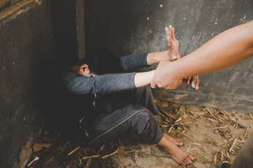 Scared or terrified boy sitting at wall. Aggressive parent and frightened child in corner. Domestic...