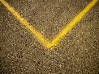 V shaped sign on a concrete pavement 