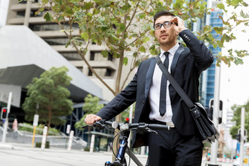 Young businessmen with a bike