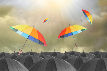 Different colorful umbrella holding