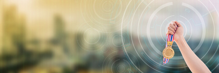 Winner holding gold medal victory success