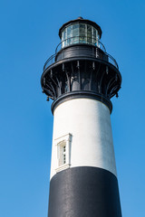 Close-up view of the top of the Bodie Island lighthouse on the Outer Banks of North Carolina near...