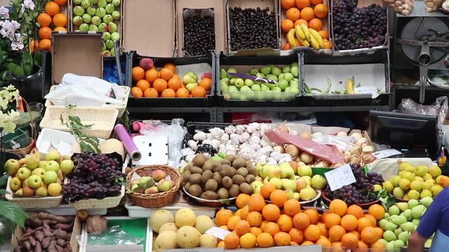 Farmers Market Fruits Section. Fruit section in a farmers market in operation, high angle view

