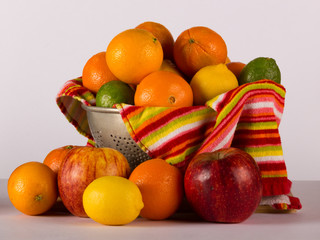 Colander of Citrus and Apple Fruit