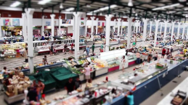 Farmers Market Crowd Time Lapse Tilt Shift. Top view of a huge farmers market with crowd in operation on a busy day