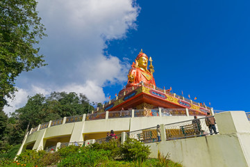 Samdruptse statue , a huge buddhist memorial statue in Sikkim, blue cloudy sky in background. It is a fourite tourist spot in Sikkim.