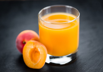 Obraz na płótnie Canvas Apricot Juice (selective focus, close-up shot)