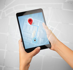 Female hand holding tablet